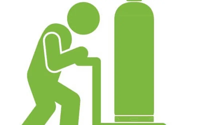 a cartoon of a green man pushing a gas cylinder on a trolley